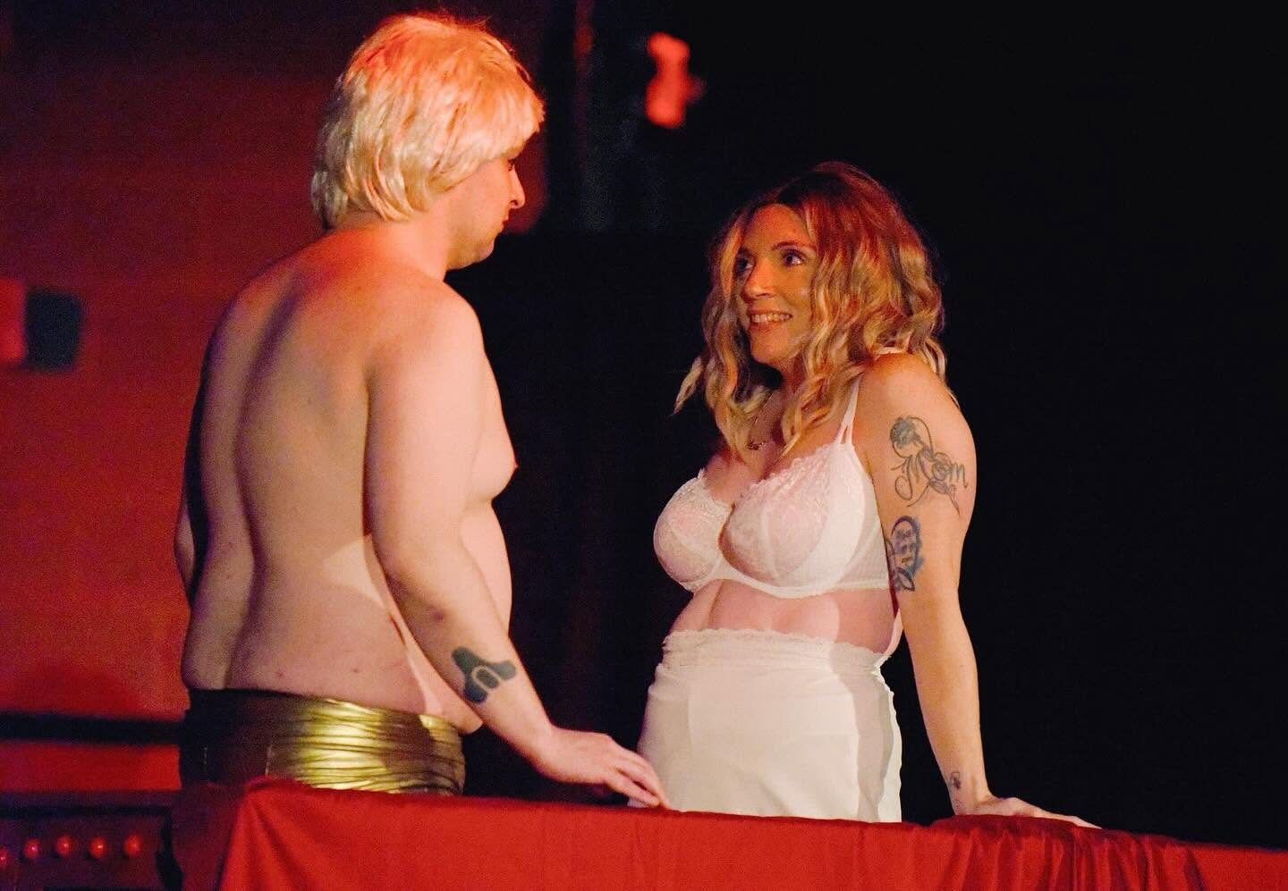 Rocky and Janet on stage in red light
